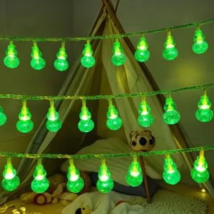 Close-up of green LED gourd string lights glowing brightly, ideal for bedroom room decor.