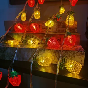 Creative LED strawberry pineapple string lights for bedroom room decor and party ambient lighting.