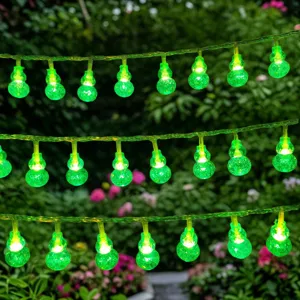 Green gourd LED string lights close-up detail, glowing outdoor garden camping decorative lighting.
