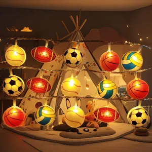 Close-up of colorful sports ball LED string lights, glowing in a cozy children tent.