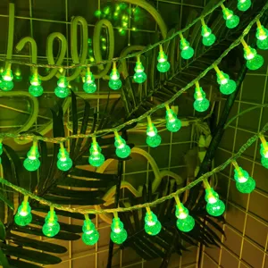 Close-up detail of glowing green LED gourd string lights, ideal for stunning room and outdoor decor.