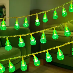 LED gourd string lights detail view, glowing green decorative ambiance lighting for room bedroom.