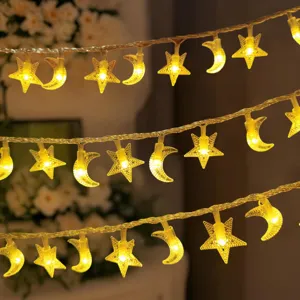 Close-up of warm glowing star and moon LED string lights, creating a cozy holiday ambiance.