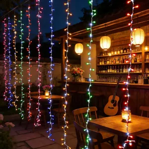 Detailed shot of LED curtain string lights creating a cozy ambient glow for holiday patio decor.