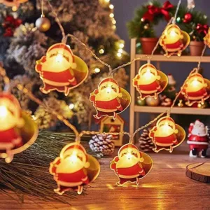 Santa Claus LED string lights detail, warm glowing holiday fairy lights for Christmas decor.