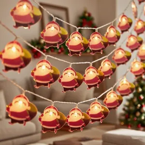 LED Santa Claus string lights detail showing glowing festive pendants in a cozy room setting.