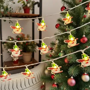 Christmas snowman LED string lights scene detail, warm holiday decorative ambient lighting.