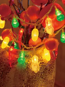 Festive LED string lights with cute vegetable shapes for cozy holiday indoor home decoration.