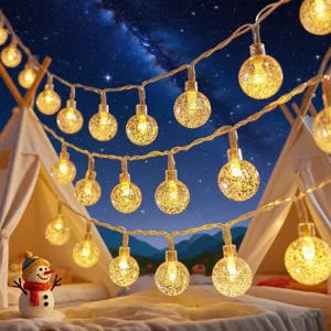 Detailed view of LED crystal ball string lights, perfect for room decor and warm ambiance.