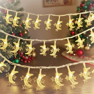 LED moon and star string lights detail shot, warm glowing fairy lights for cozy holiday decor