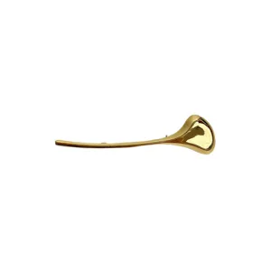 Close-up detail of a elegant gold-tone smooth metallic organic sculptural leaf brooch pin.