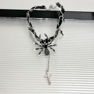 Dark gothic punk spider choker necklace with cross pendant and leather chain for women.