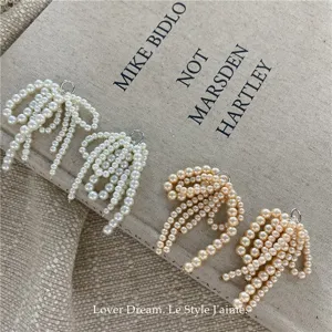 Pearl bow shoe clips and charms, elegant high-end accessories for stylish footwear.
