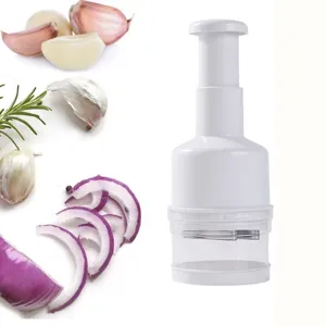 Detail view of manual garlic press and onion chopper with clear container for kitchen use.