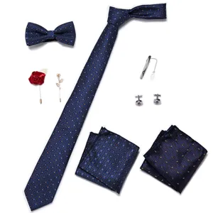 Heren blauw gestipte stropdas vlinderdas pochet broche manchetknopen set voor trouwen.