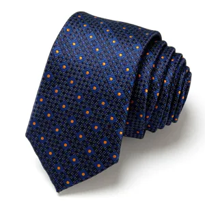 Men's navy blue jacquard necktie with orange polka dots, elegant business wedding accessory.