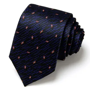Detailed close-up view of a luxury men's dark blue patterned silk business necktie accessory.