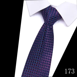 Close-up detail of the dark blue and purple jacquard patterned men's formal suit tie.