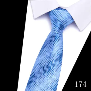 Detailed shot of a light blue jacquard wave pattern necktie with white shirt collar accent.
