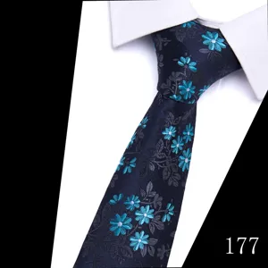 Detailed view of the dark blue floral jacquard men's necktie, elegant fabric texture.