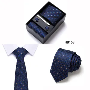 Detailed view of the blue geometric pattern men's tie set with pocket square and cufflinks.