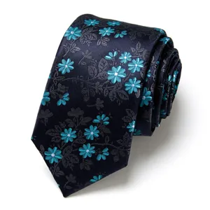 Detailed view of the elegant men's jacquard patterned necktie showing fine floral texture.