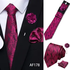Mens purple jacquard tie set with matching pocket square and lapel flower for business.