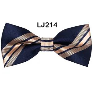 Navy blue bow tie with elegant champagne diagonal stripes, smooth fabric texture detail.