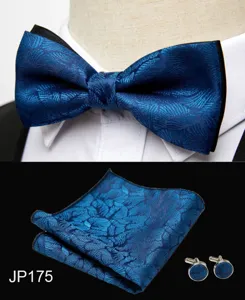 Detailed view of men blue jacquard bow tie, pocket square and cufflinks formal set.