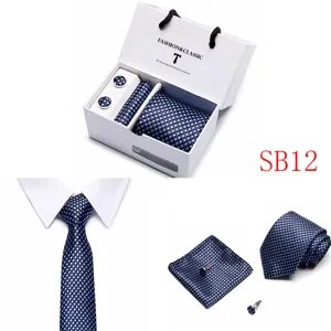 Detailed view of the elegant blue polka dot tie, pocket square, and cufflinks gift box.