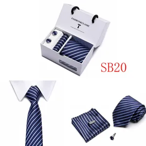 Detail display of luxury blue striped mens tie set including pocket square and cufflinks.