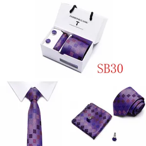 Detail shot of purple checkered mens tie set with pocket square cufflinks in gift box display.