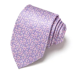Detail shot of a men's purple and pink speckled jacquard necktie, elegant formal wedding accessory.