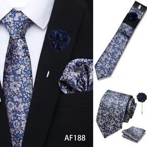 Men's blue floral jacquard tie set with pocket square and lapel pin for business wedding.