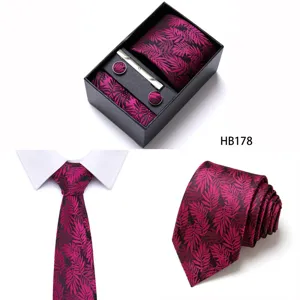 Detailed view of mens business tie set featuring leaf pattern, gift box and cufflinks.