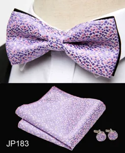 Detail shot of men's purple jacquard bow tie, pocket square, and cufflinks set.