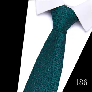 Close-up detail view of elegant dark green houndstooth jacquard men's business tie texture.