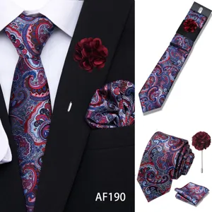 Men's paisley silk tie pocket square and lapel pin set detail view showing classic pattern.