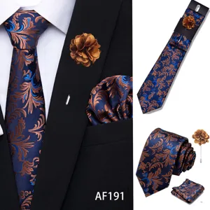 Detail view of men tie set, floral jacquard pattern, blue and brown color, suit accessory.