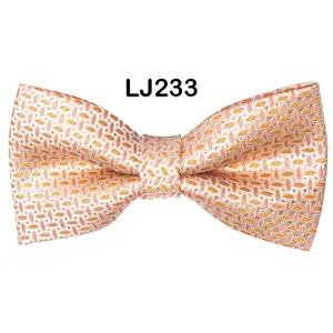 Detail view of a men's business wedding jacquard polyester silk bow tie in orange.