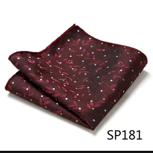 Detail shot of a classy burgundy pocket square featuring delicate leaf and dot print.