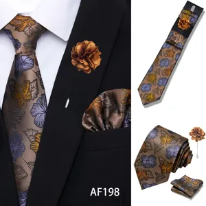 Close up detail view of men brown floral jacquard tie pocket square and flower set.