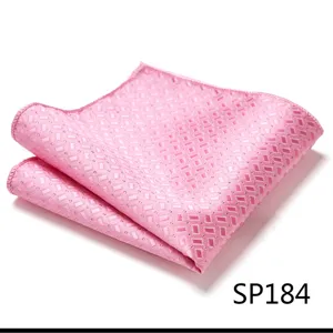 Pink geometric pocket square detail, soft fabric texture, elegant men's formal suit accessory.