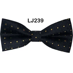 Men's black jacquard bow tie featuring gold stars pattern, ideal for wedding party.