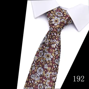 Men's floral woven necktie detail, elegant retro flower pattern for business wedding.
