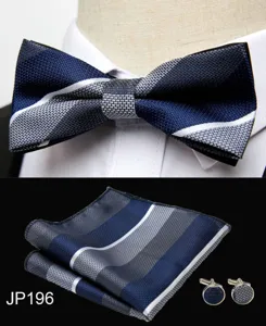 Detail shot of blue striped bow tie, pocket square, and cufflinks set for formal suits.