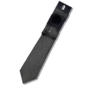 Men's black tie set with silver square pattern, matching pocket square and lapel flower for wedding business.