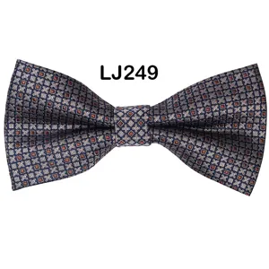Close-up detail of a navy blue star jacquard polyester bow tie, elegant wedding party wear.