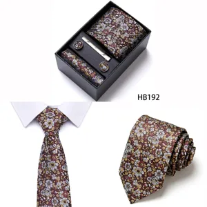 Floral jacquard men's tie set detail view, featuring pocket square and cufflinks in rich vintage floral design.
