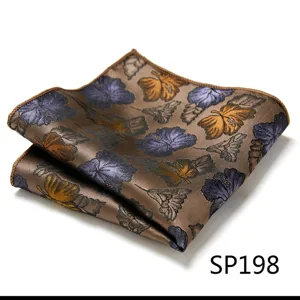 Close-up detail of a brown men's pocket square featuring elegant floral print and neat edge stitching.